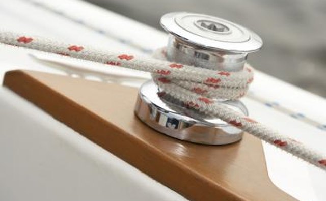 A close up of a pulley on a sailing boat.