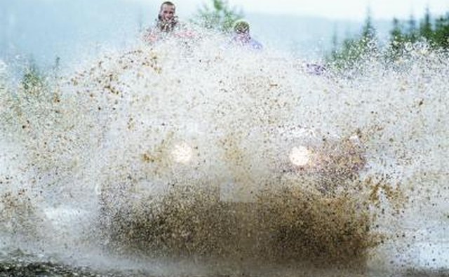 ATV driving through mud