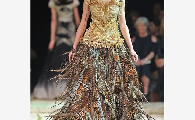 A model walks down the runway in the Alexander McQueen Spring/Summer 2011 show in Paris.
