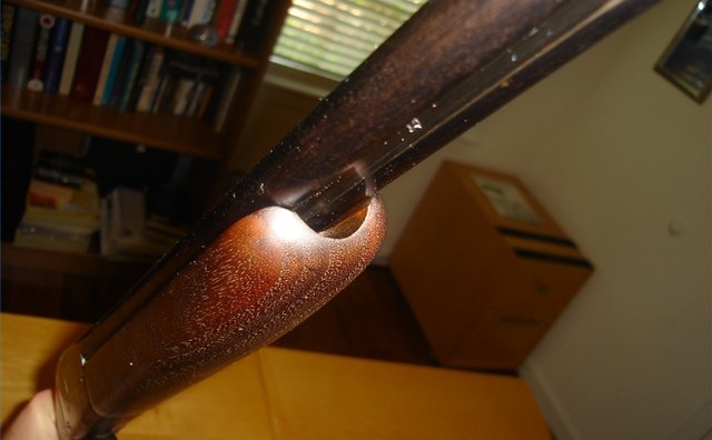 Here is the large rounded notch under the forearm. Pull here with your finger.