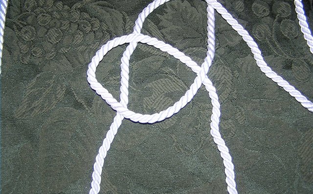 Standing ends of the ropes crossed