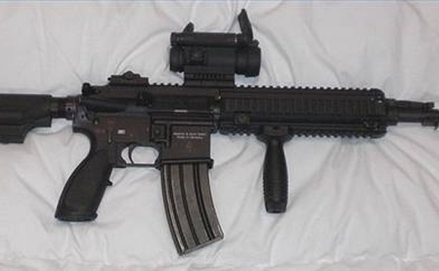 Red dot sight mounted on sporter rifle
