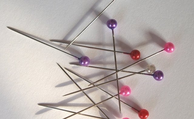 Use pins to hold fabric while sewing.