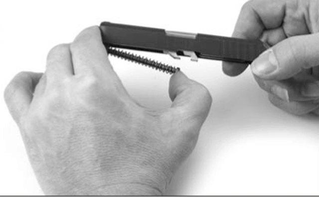 Remove the Recoil Spring Assembly