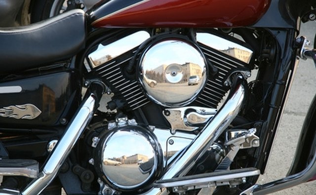 The engine cylinder is generally visible as a coated, round part with numbers stamped or etched into its surface