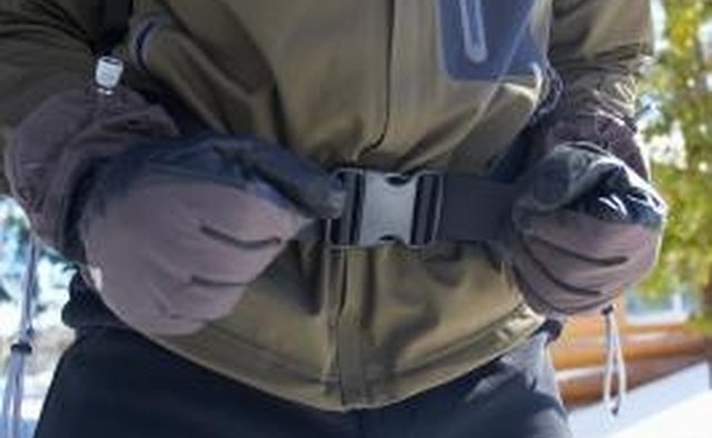 The straps should be flush against each other, looped over the divider in the buckle.