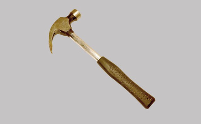 Pull the floor up with a pry bar and a hammer.