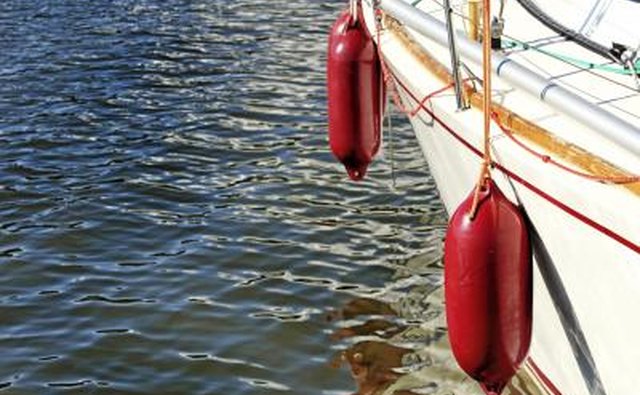 Fenders between boat and pier prevent damage.