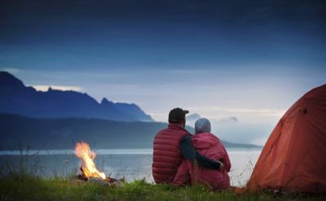 Couple hugging outside tent