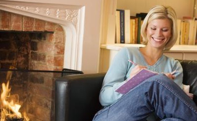 Woman sitting next to fireplace