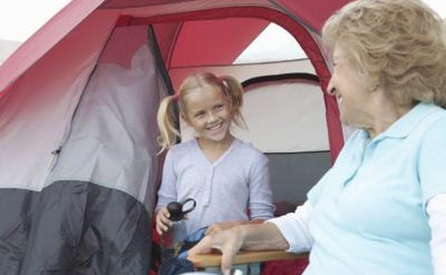 Little girl smiling outside tent