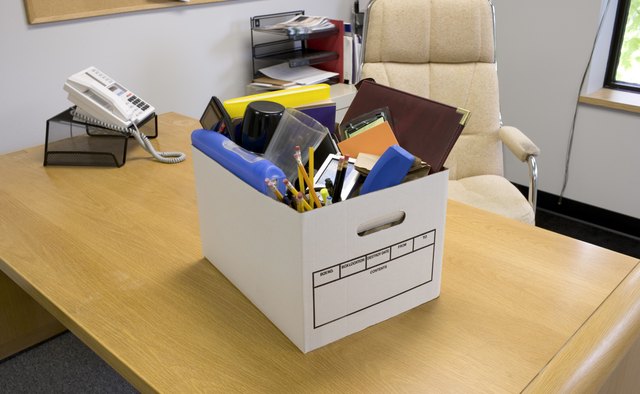 Box of office supplies on desk