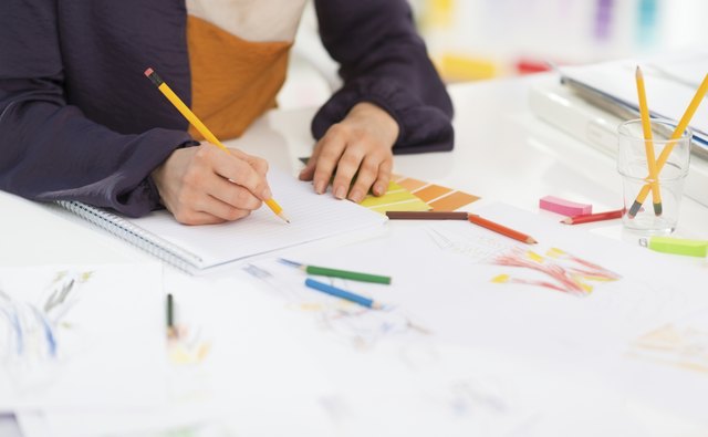 closeup on fashion designer working in office