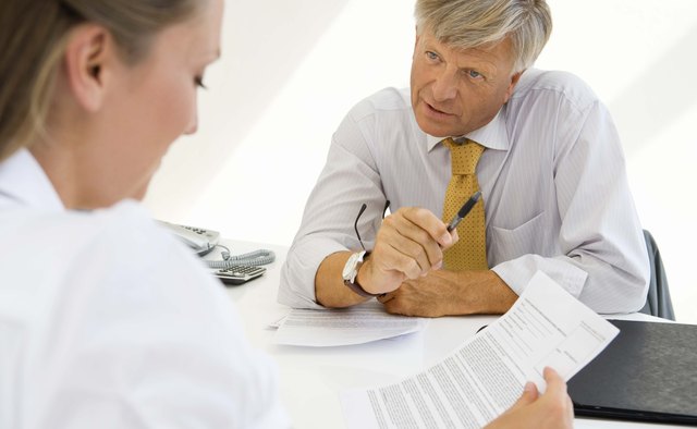Woman with document and financial adviser