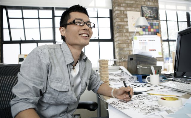 Young illustrator smiling away from the camera