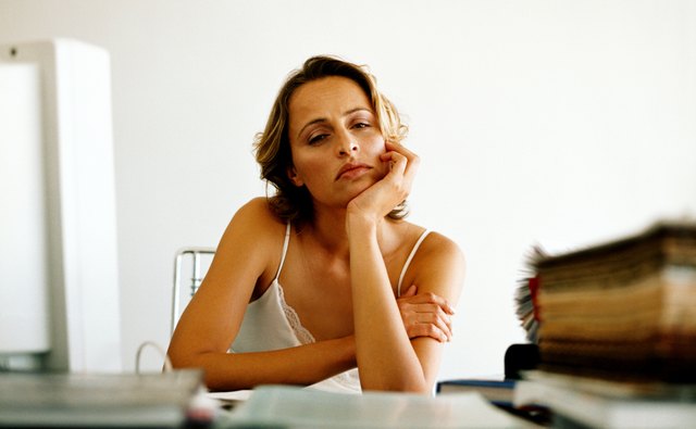 A young woman sitting at a desk