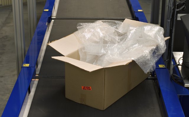 Open box on conveyor belt