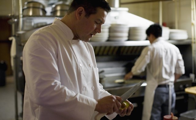 cooks working in kitchen