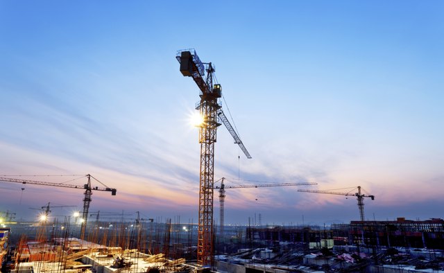 buildings under construction with sunset