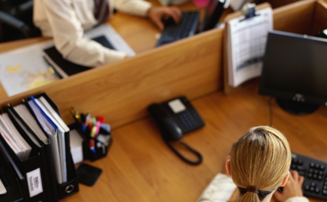 high angle view of a businessman and a businesswoman working in an office