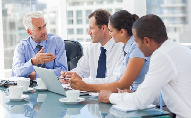 Group of business people brainstorming together
