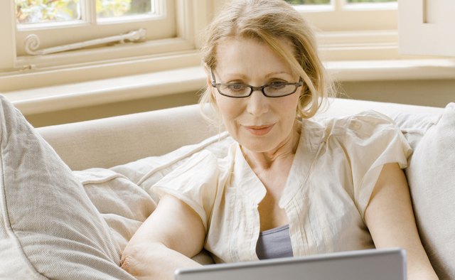 Woman with eyeglasses and laptop computer