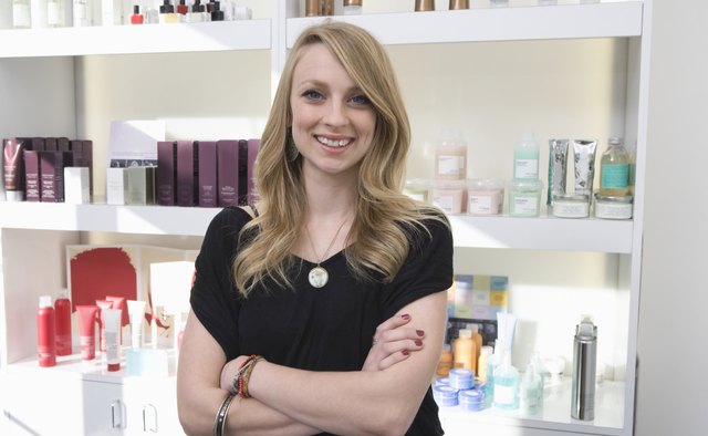Young woman standing in the hairdressers