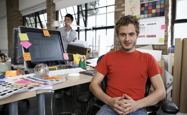 Portrait of a young designer in his office
