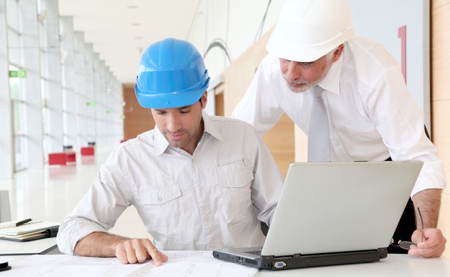Architects working on construction plan