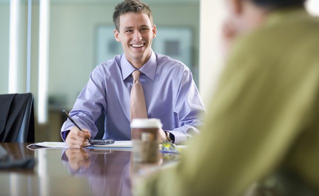 Young Businessman Smiling During Meeting