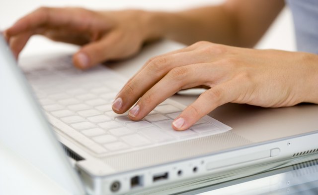 Woman's hands typing