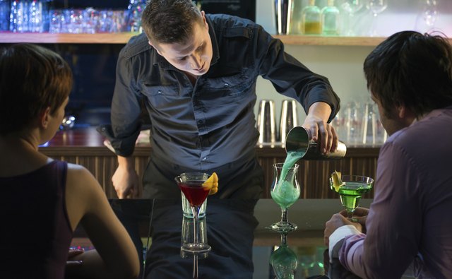 Happy couple celebrating together in Bar