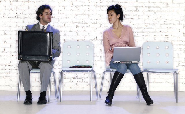 Opposite styles of businesspeople in waiting room
