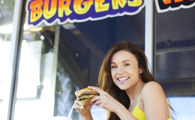 Cheerful Woman Having Burger