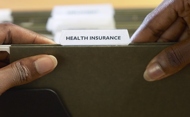Close-up of hands holding a folder