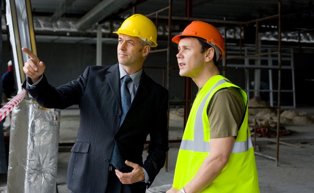 Foreman and architect at construction site