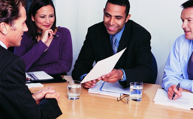 Three Business Colleagues Interviewing a Businessman