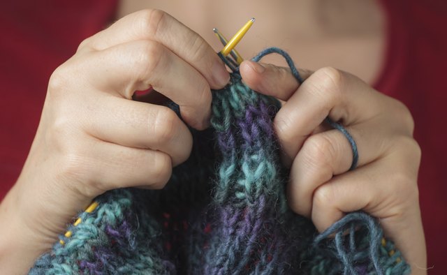 Woman knitting a sweater