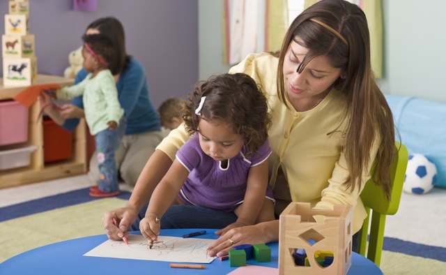 day care worker with child
