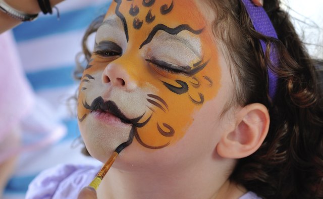 Girl having her face painted.