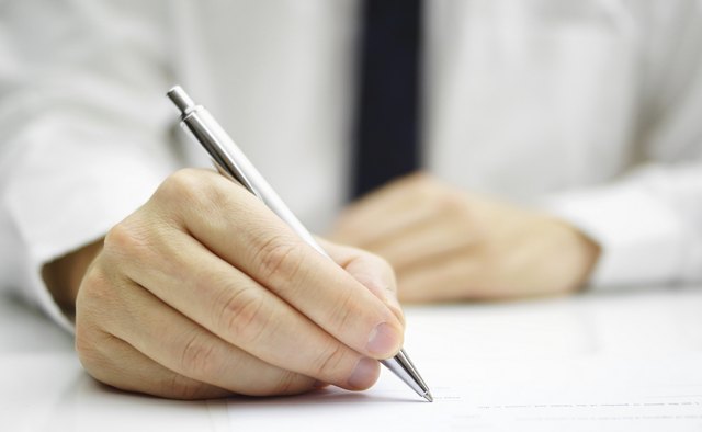 businessman is signing agreement