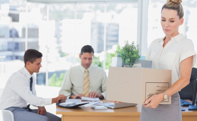Businesswoman leaving office after being fired