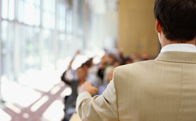rear view of a businessman giving presentation at a seminar