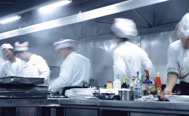 motion chefs of a restaurant kitchen