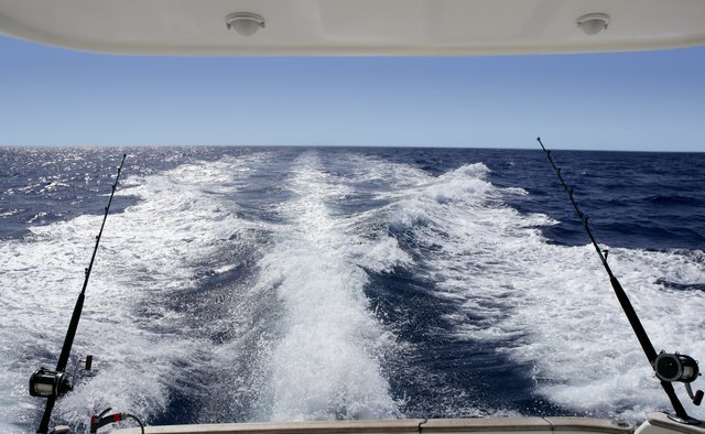 Fishing boat in a big game summer blue morning