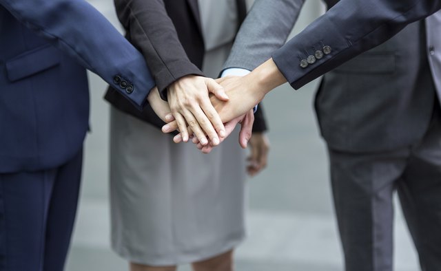 Business team joining hands
