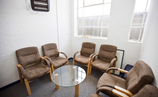 Interior of waiting room with chairs and table in television station