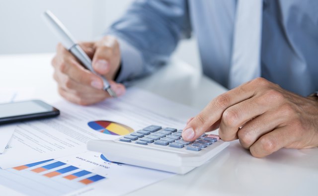 Businessman Doing Calculations