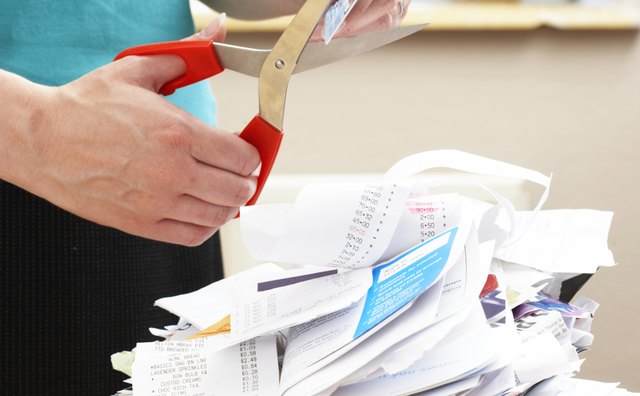 Shred papers with personal information and cut up expired credit cards.