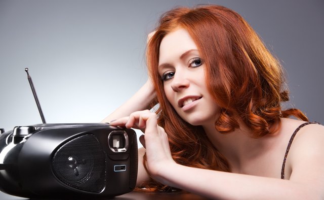 Young woman listening radio